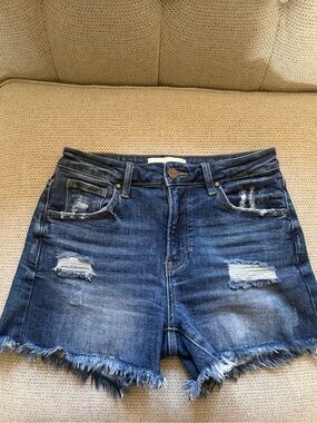 Women's Distressed Dark Blue Denim Shorts with Frayed Hem